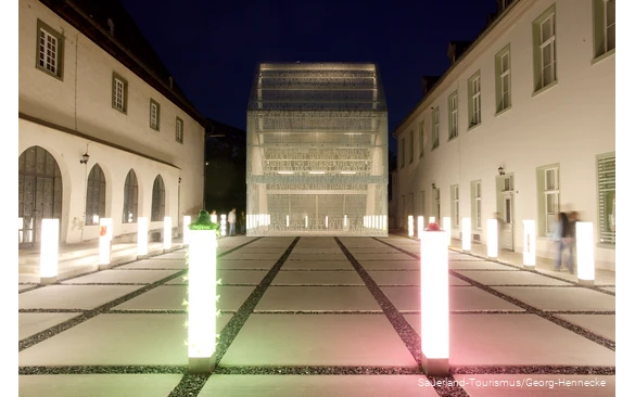 The inner courtyard of Wederinghausen Monastery illuminated with light columns