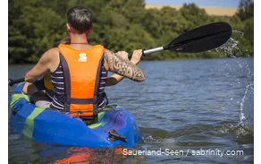 Man and a child canoeing
