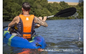 Man and a child canoeing
