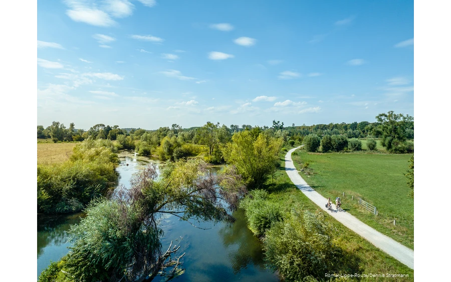 Cyclist next to the Lippe captured by drone