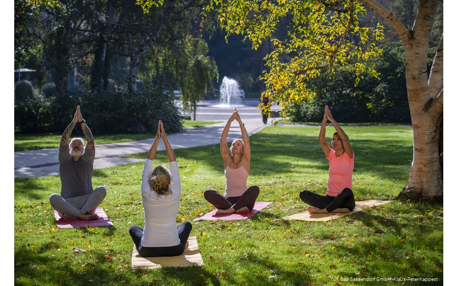 A yoga group in the spa gardens in Bad Sassendorf