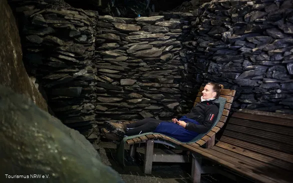 A woman sits in the cave in Nordenau