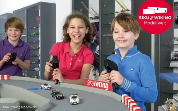 Children play in the Siku model world