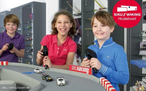 Children play in the Siku model world