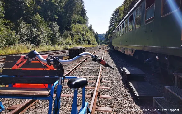 A trolley stands on the tracks.
