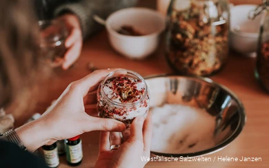 Close-up of hands holding a homemade bath salt