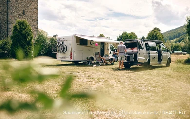 Two families camping on a pitch in the Sauerland.