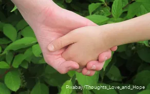One hand holds the other hand.