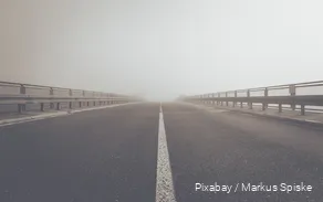 View of a car bridge in the fog.