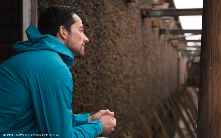 A man takes a deep breath at the Gradierwerk
