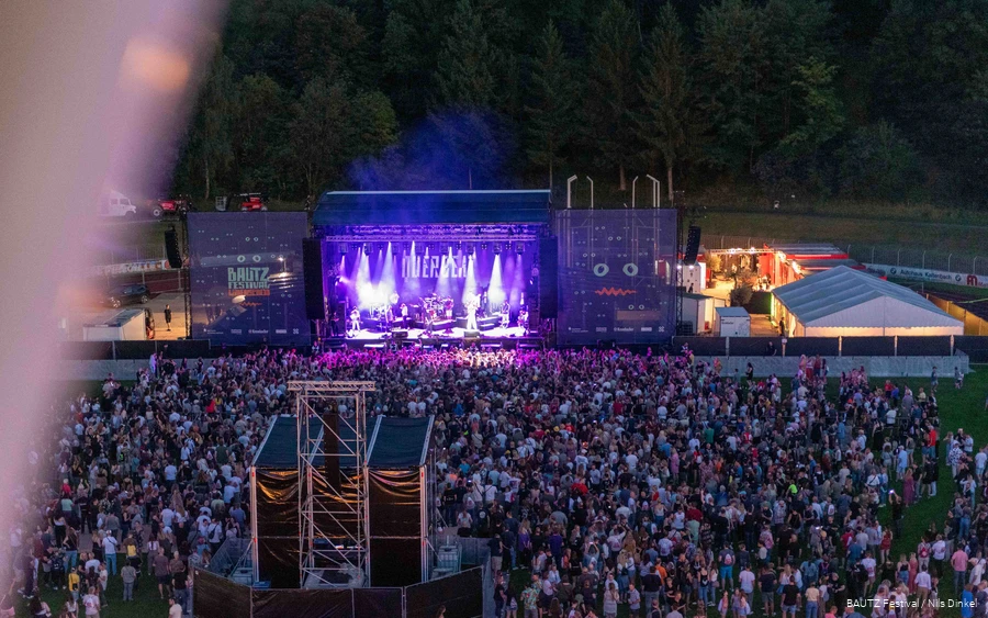 Aerial view of the Bautz festival site with a large stage and a crowd in front of it
