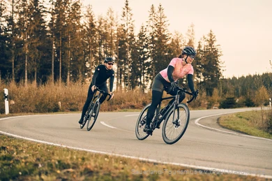 Two racing cyclists on the road in the Sauerland