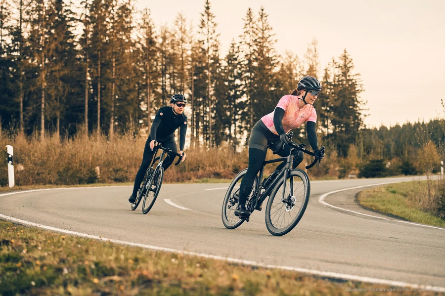 Two racing cyclists on the road in the Sauerland