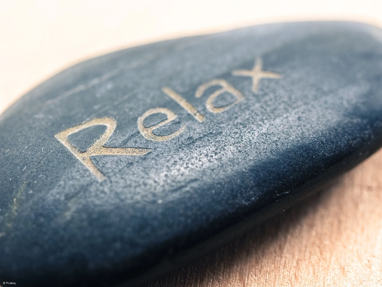Symbolbild - Stein mit Beschriftung "Relax" Symbolbild - Stein mit Beschriftung "Relax"