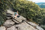 Simone Schwerdtner with dog at the viewpoint