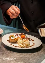 Preparing a dish in the kitchen of the Oversum in Winterberg.