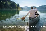 Man canoeing on the Hennesee.