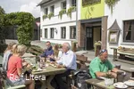 Guests enjoy their food in Steinberg's outdoor restaurant.