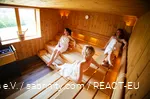 Three women relaxing in a sauna.