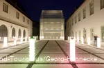 The inner courtyard of Wederinghausen Monastery illuminated with light columns
