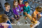 Children experimenting at a table.