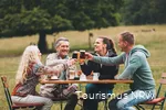 A group toasts with drinks.