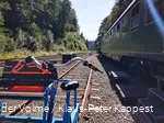 A trolley stands on the tracks.