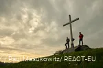 Two hikers enjoy the sunset on the Clemensberg.