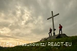Two hikers enjoy the sunset on the Clemensberg.